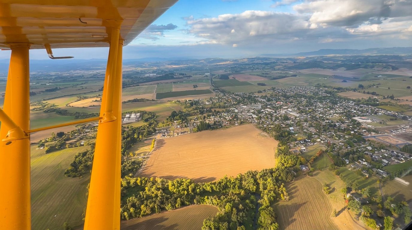 Carlton comes back into view, surrounded by the fields that give it its shape.